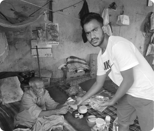 Volunteer serving a meal to a person in need